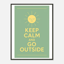 Keep Calm and Go Outside wall art poster in black metal frame featuring cheerful sun illustration and inspirational nature quote