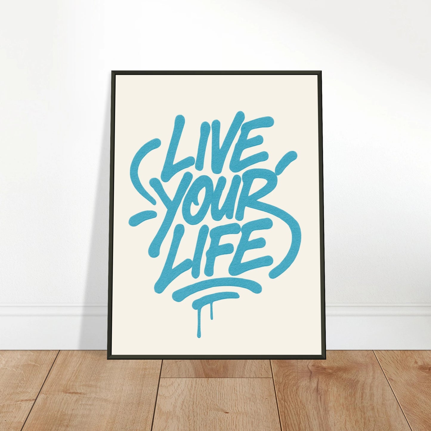 Live Your Life Blue wall art poster leaning against wall in black metal frame modern studio decor mockup