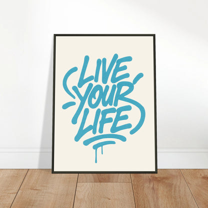 Live Your Life Blue wall art poster leaning against wall in black metal frame modern studio decor mockup