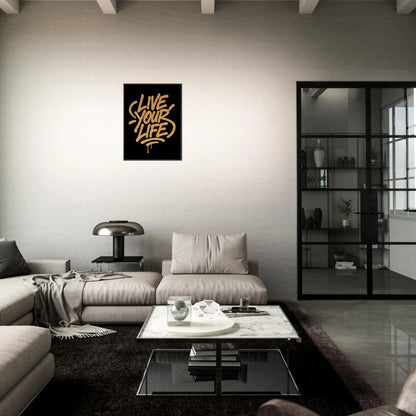 Live Your Life motivational poster in black metal frame styled in dark modern living room setting