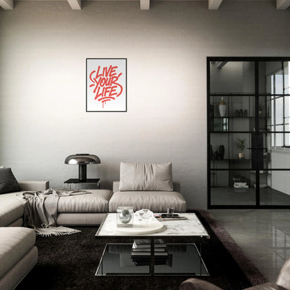 Live Your Life red motivational poster in black metal frame styled in dark modern living room setting