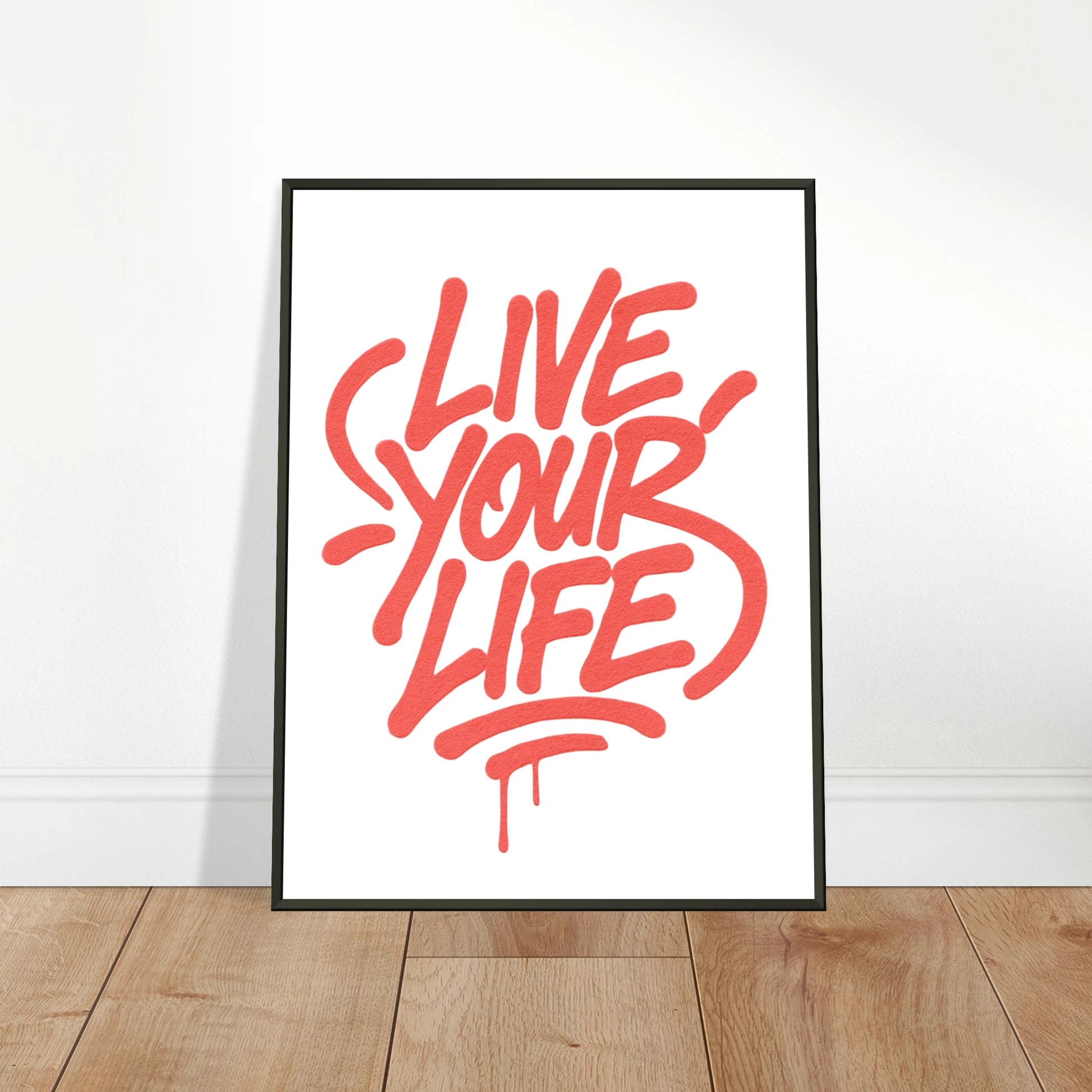 Live Your Life red wall art poster leaning against wall in black metal frame modern creative interior mockup