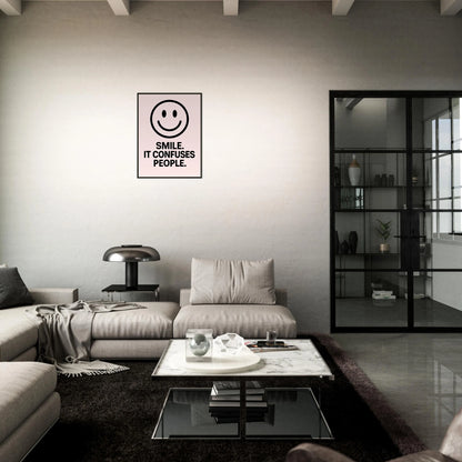 Smile Blush Pink quote poster in black metal frame styled in dark modern living room setting